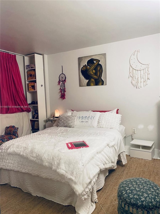 bedroom featuring hardwood / wood-style flooring