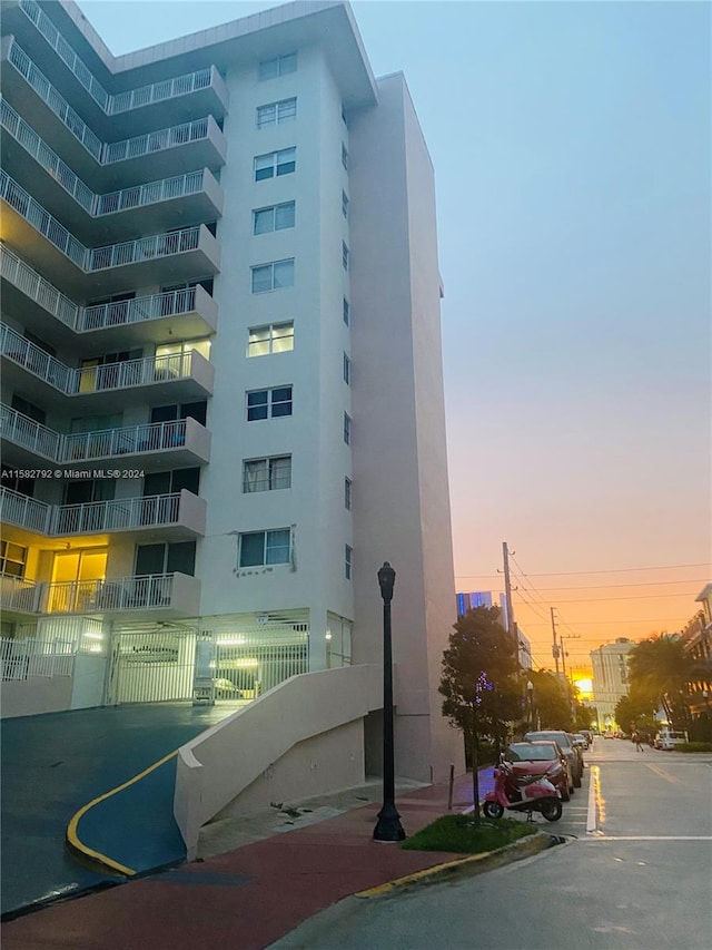 view of outdoor building at dusk