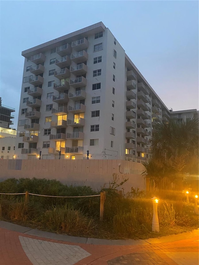 view of outdoor building at dusk