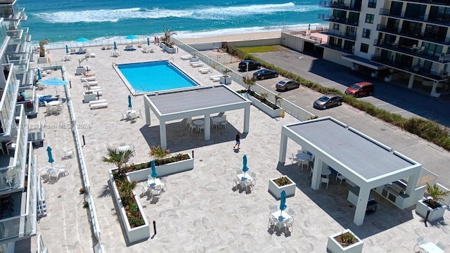 aerial view featuring a water view and a view of the beach