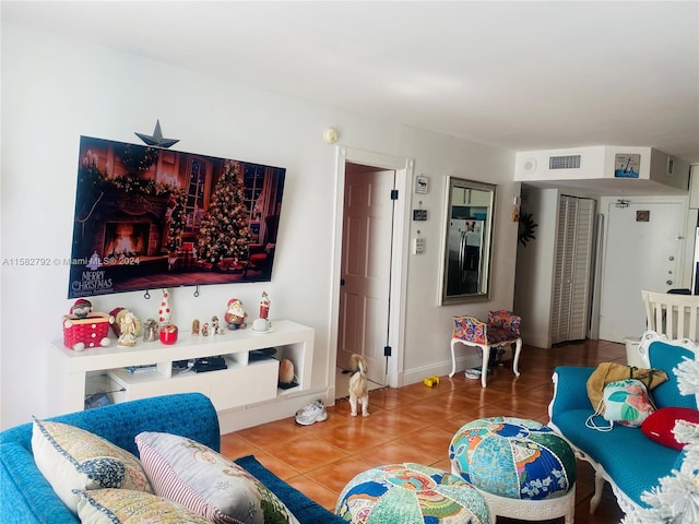 living room with tile patterned flooring