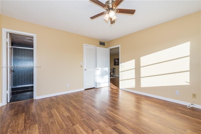 unfurnished bedroom with hardwood / wood-style flooring and ceiling fan