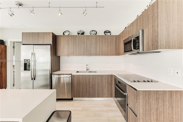 kitchen with sink and stainless steel appliances