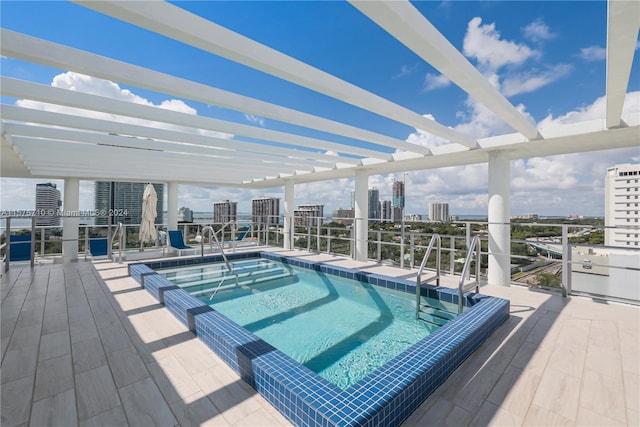 view of swimming pool with a pergola