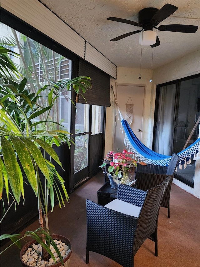 sunroom / solarium with ceiling fan