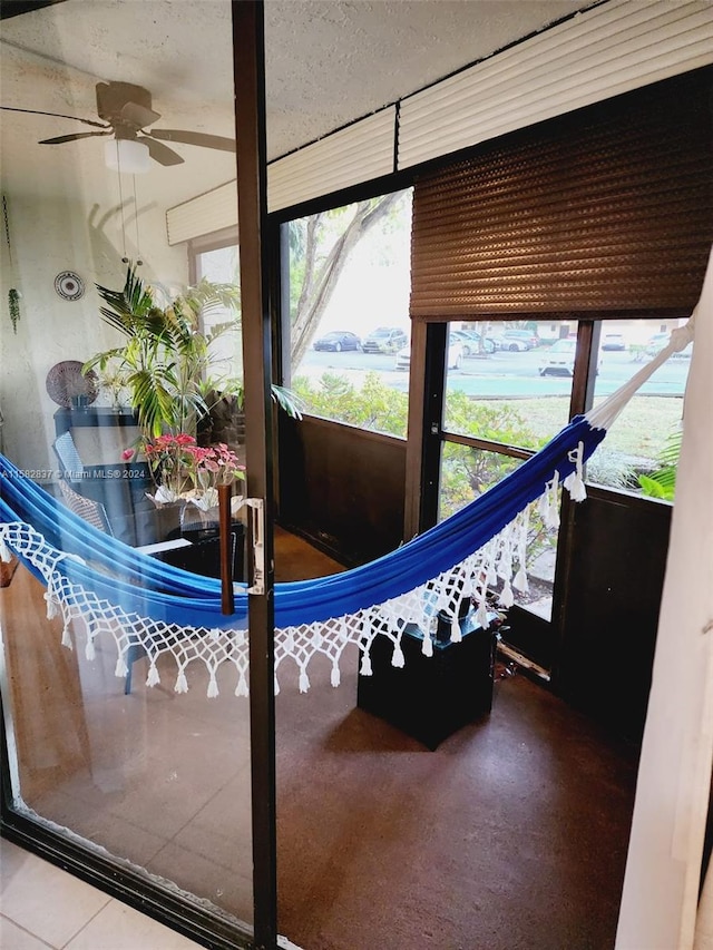 interior space featuring ceiling fan