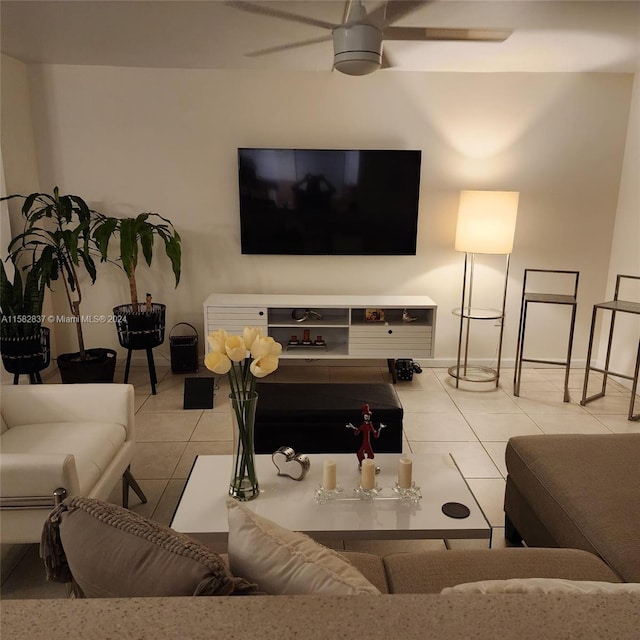 living room with ceiling fan and light tile flooring