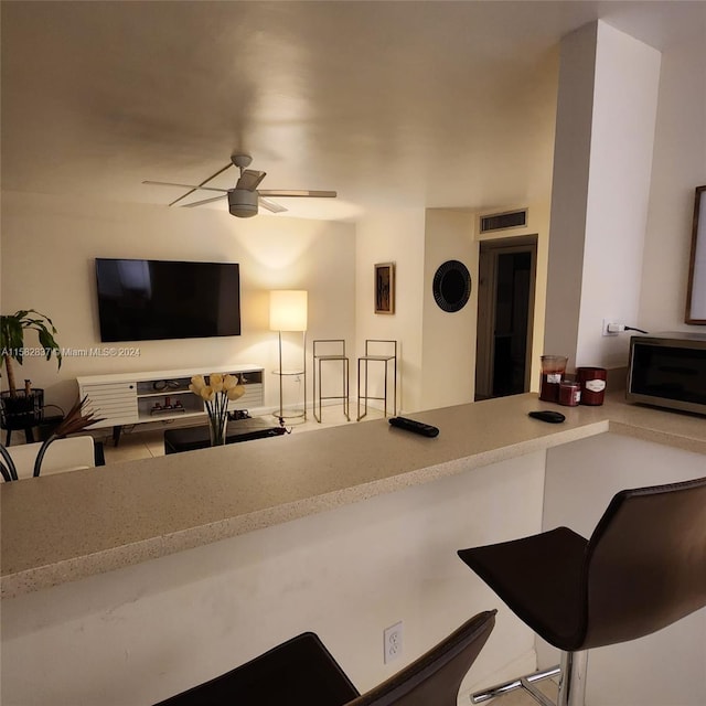 interior space featuring ceiling fan