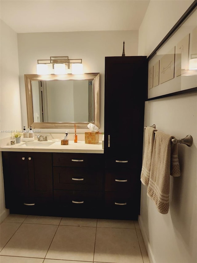 bathroom featuring vanity with extensive cabinet space and tile flooring