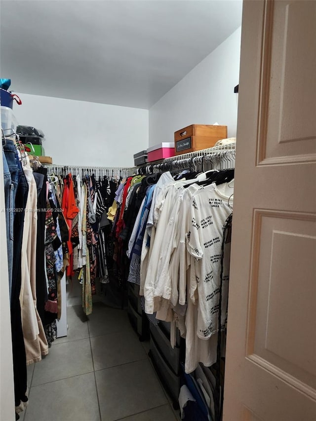 spacious closet featuring tile floors