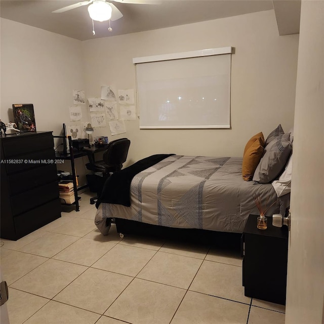 tiled bedroom with ceiling fan