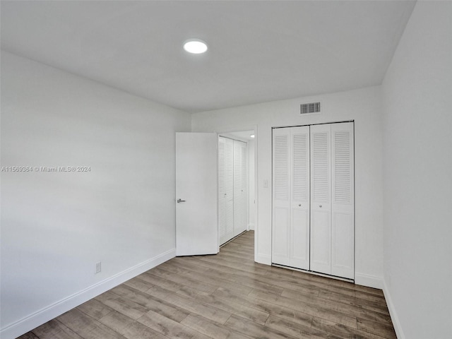 unfurnished bedroom featuring hardwood / wood-style floors