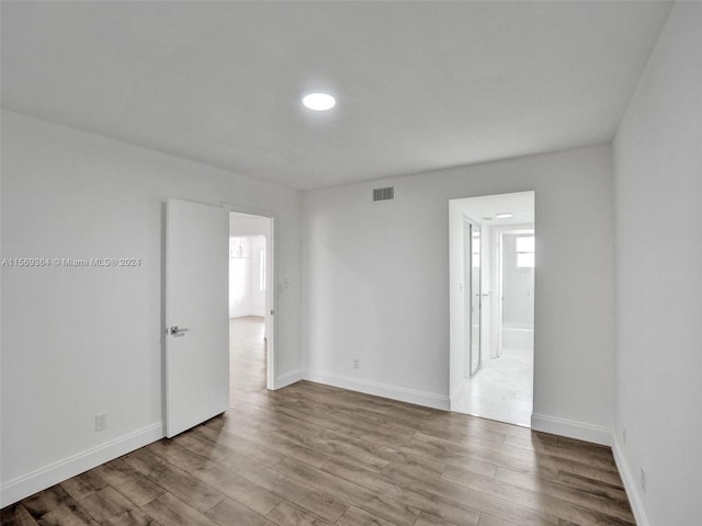 empty room featuring hardwood / wood-style floors