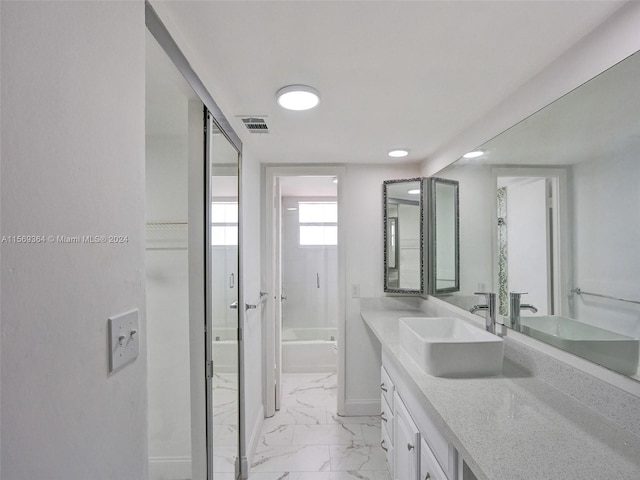 bathroom featuring tile patterned flooring and vanity