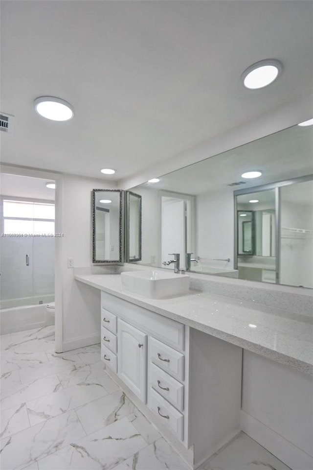 bathroom with tile patterned floors, shower / bathtub combination, and vanity