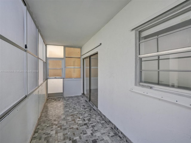 hallway featuring tile patterned floors