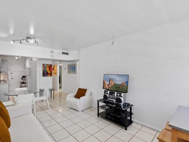 tiled living room with rail lighting