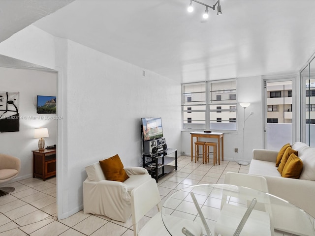 tiled living room with rail lighting