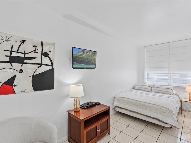 bedroom with light tile flooring