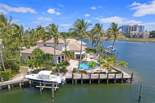 view of dock featuring a patio area and a water view