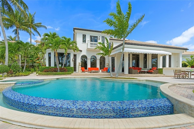 view of swimming pool with a patio area