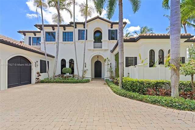 mediterranean / spanish-style home featuring a garage