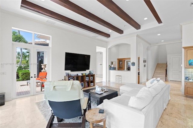 living room featuring french doors, ornamental molding, beamed ceiling, and light tile flooring