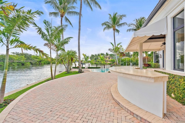 exterior space featuring a patio and a water view