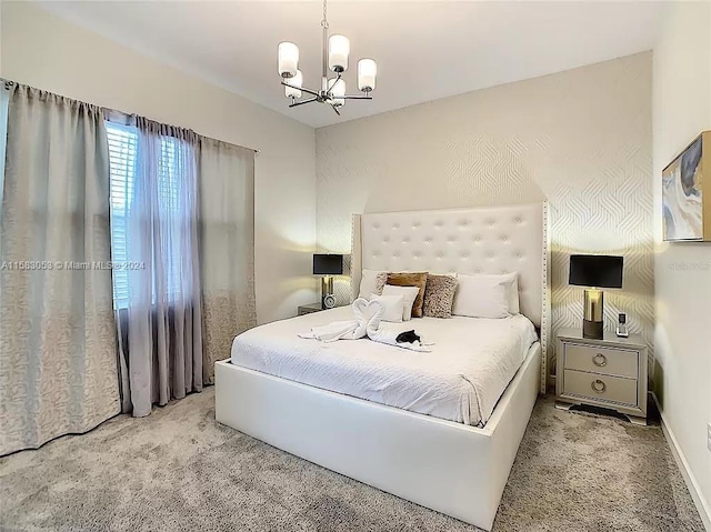 carpeted bedroom featuring a chandelier