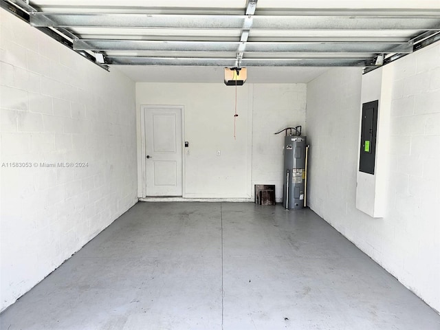 garage with water heater and a garage door opener