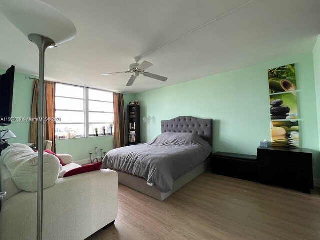 bedroom featuring ceiling fan and hardwood / wood-style flooring