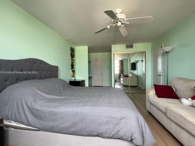 bedroom featuring a closet, ceiling fan, and hardwood / wood-style floors