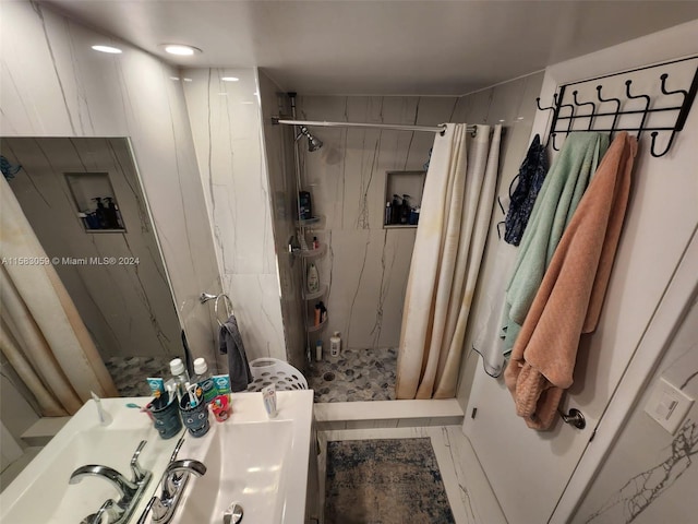 bathroom with vanity, a shower with curtain, and tile patterned flooring