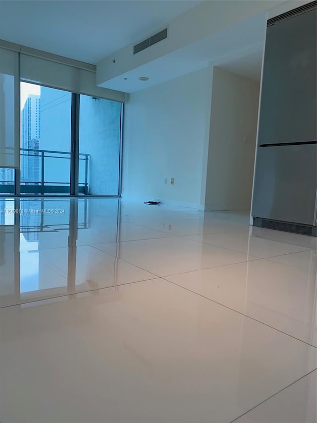 spare room with light tile patterned floors