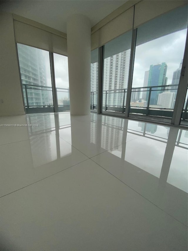 unfurnished room featuring tile patterned flooring