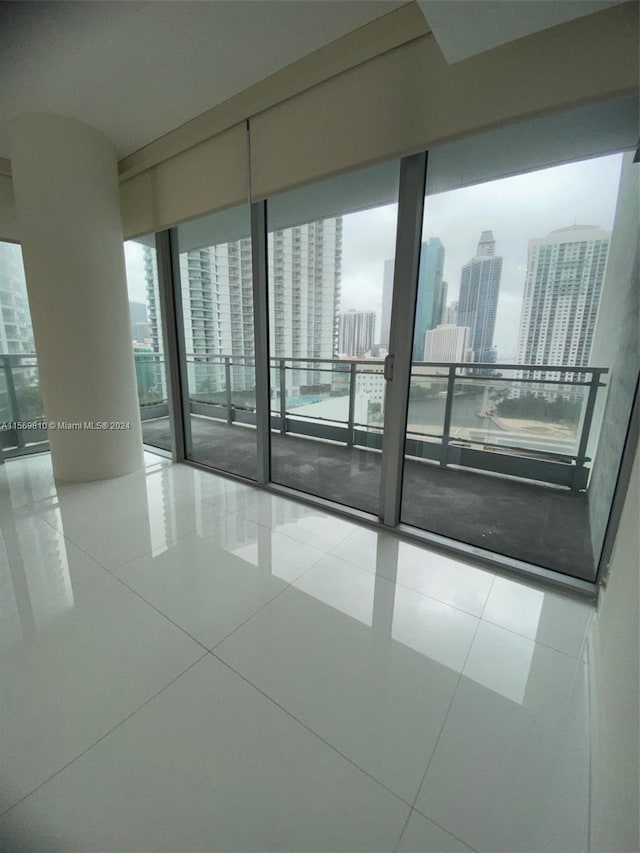 spare room with tile patterned flooring