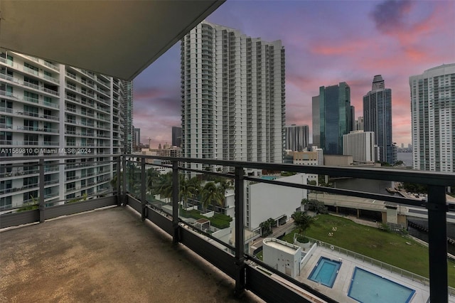 view of balcony at dusk