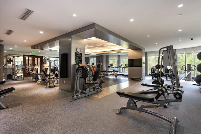 exercise room featuring plenty of natural light, visible vents, and recessed lighting