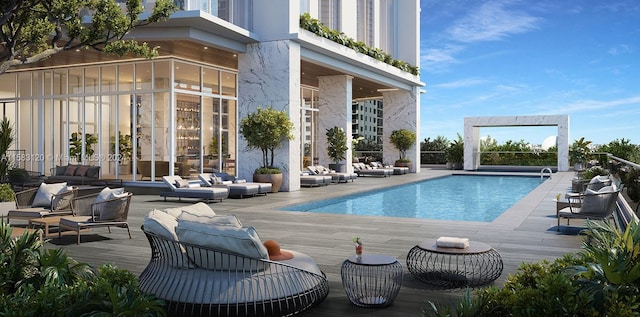 view of pool featuring a deck and an outdoor hangout area