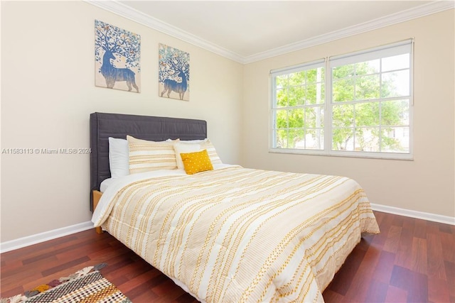 bedroom with dark hardwood / wood-style floors and ornamental molding