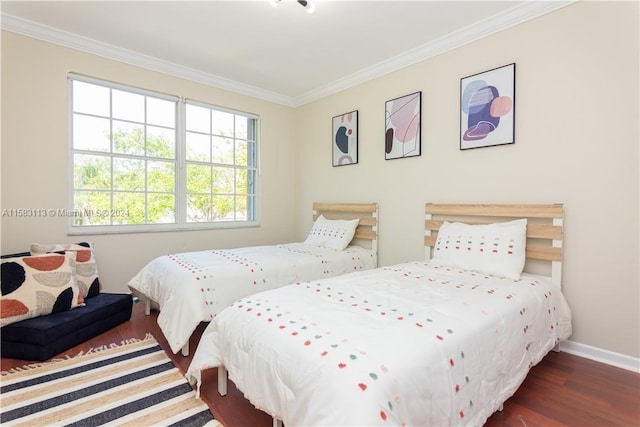 bedroom with crown molding and dark wood-type flooring