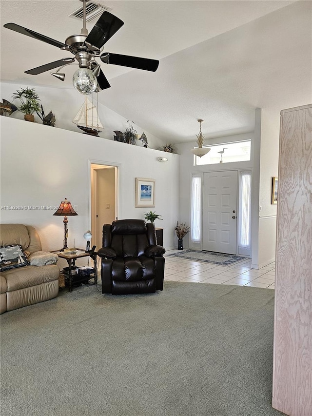 living room with lofted ceiling and light colored carpet