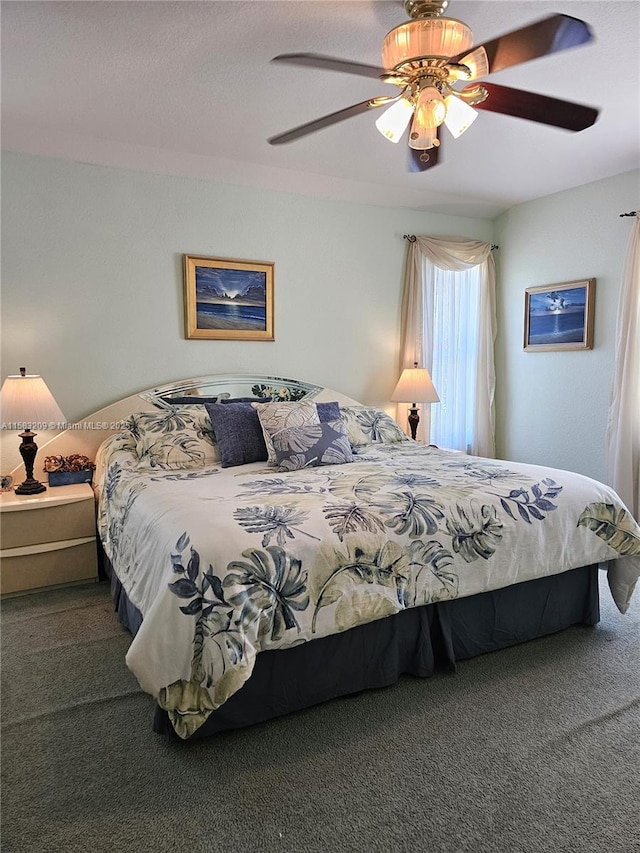 bedroom with ceiling fan and carpet