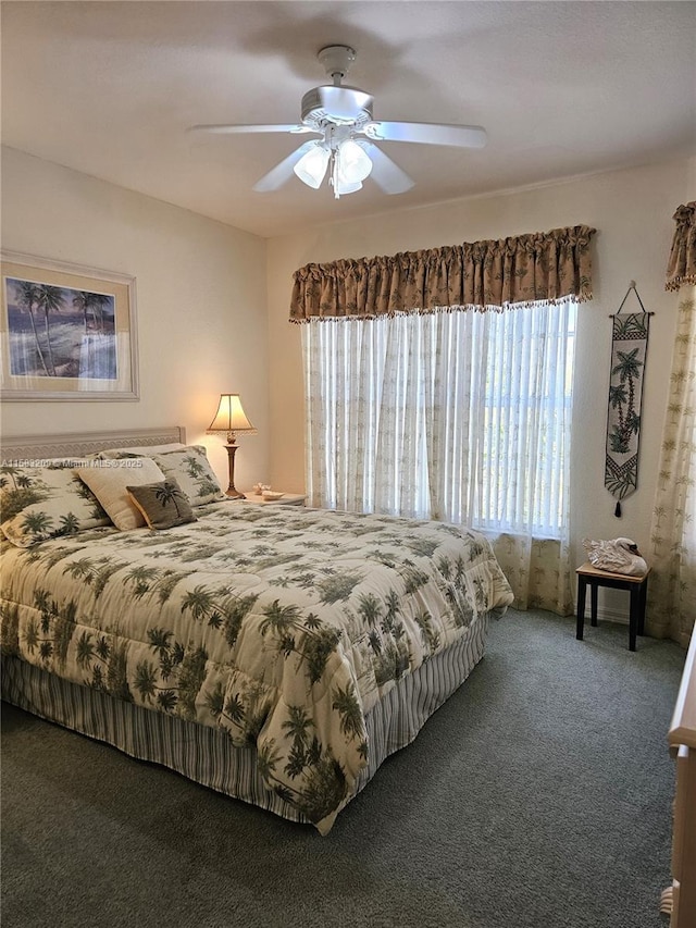 bedroom featuring ceiling fan and carpet flooring