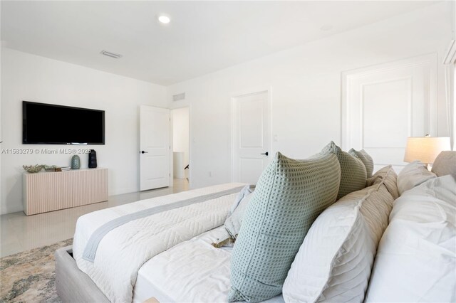 bedroom featuring tile patterned flooring, visible vents, and recessed lighting