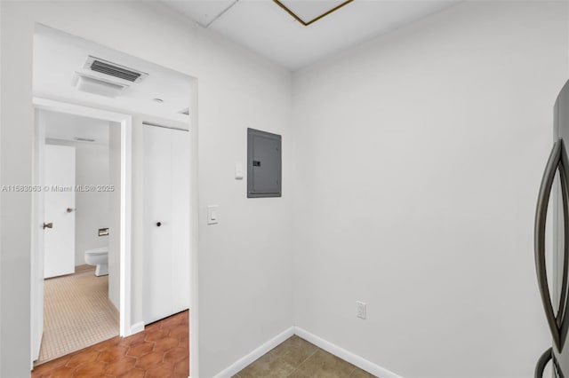 interior space with electric panel and tile patterned floors