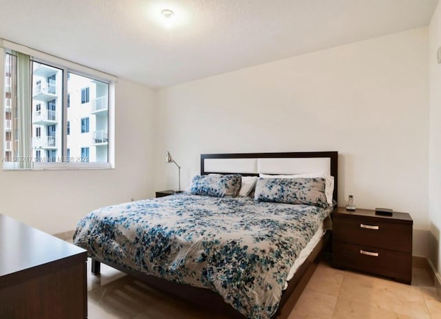 bedroom featuring light tile floors