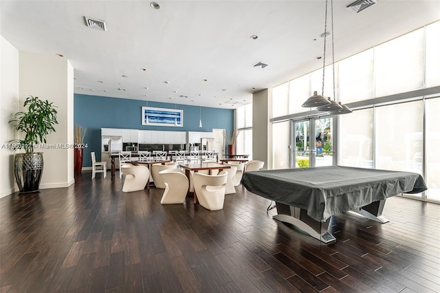 rec room featuring french doors, pool table, a high ceiling, a wall of windows, and dark hardwood / wood-style flooring