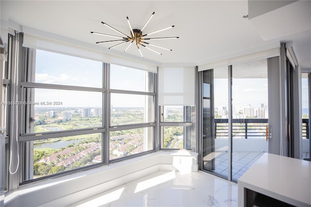 interior space with tile floors and a notable chandelier