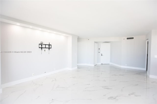 spare room featuring tile floors